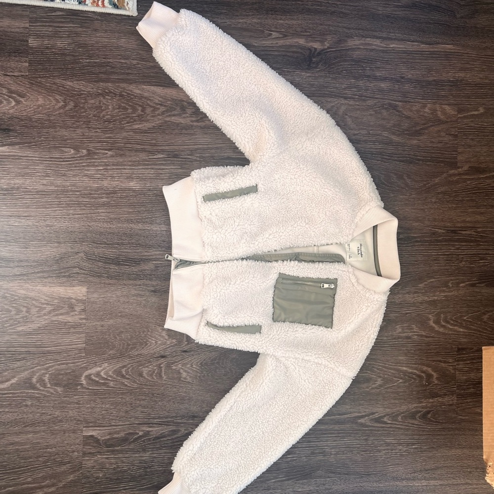 White Sherpa bomber Jacket with greyish green Accents